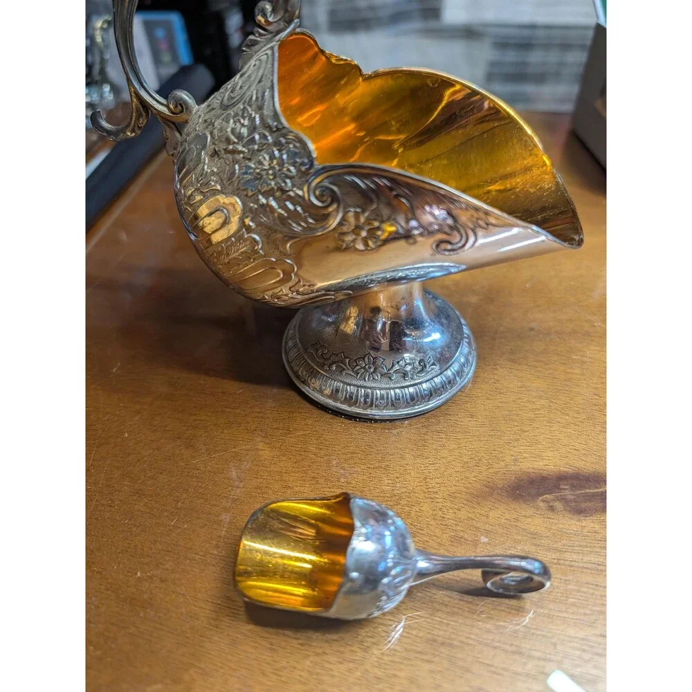 vintage silver-plated sugar scuttle with a matching mini scoop